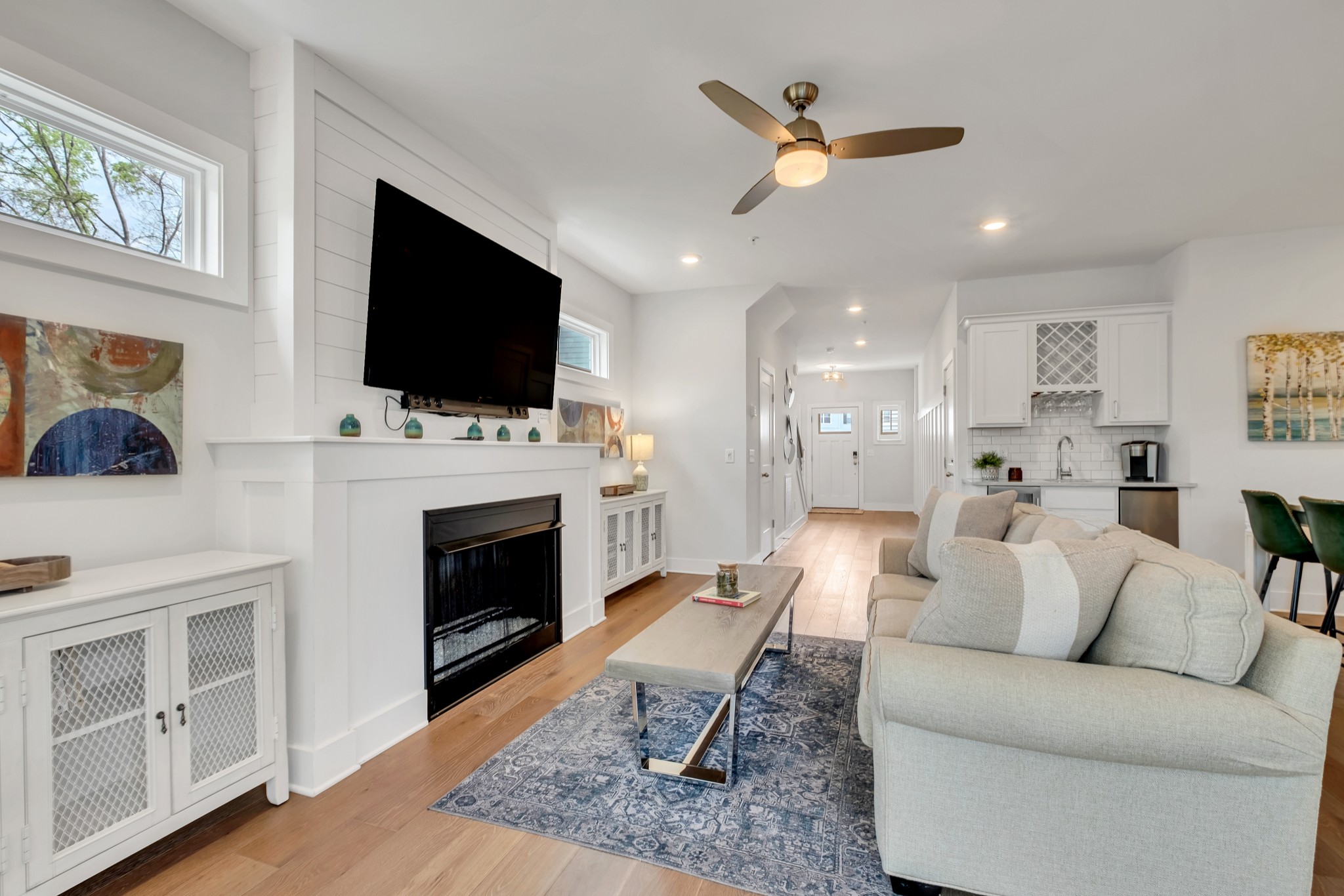 1144 Lock 4 Road, Unit F5 Gallatin, TN 37066 - Photo 14 of 40 a living room with furniture a fireplace and a flat screen tv