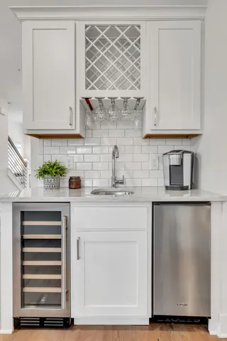 a kitchen with stainless steel appliances a sink stove and refrigerator