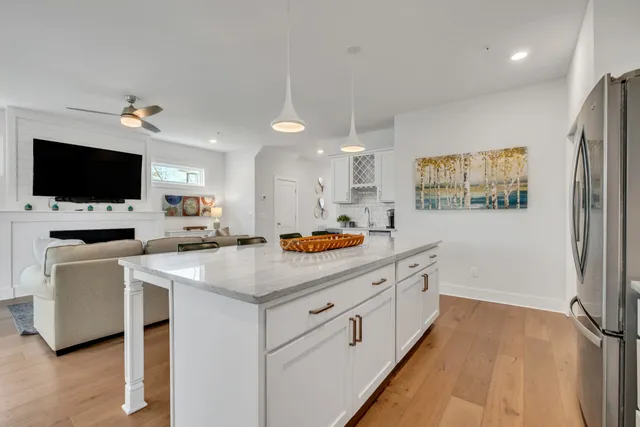 a kitchen with a stove a sink and a refrigerator