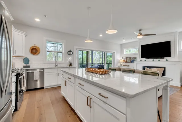 a kitchen with a sink and a large window
