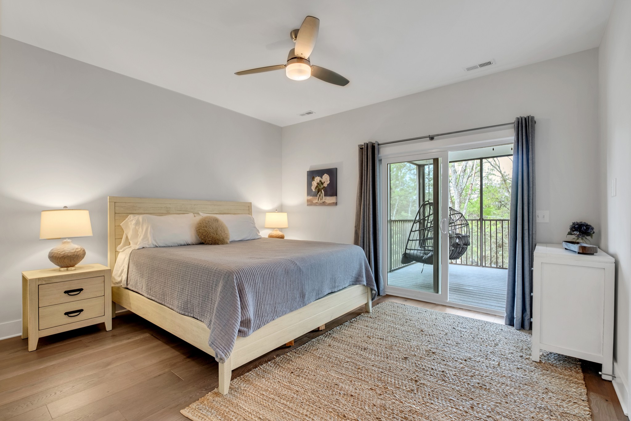 1144 Lock 4 Road, Unit F5 Gallatin, TN 37066 - Photo 27 of 40 a spacious bedroom with a large bed and a chandelier