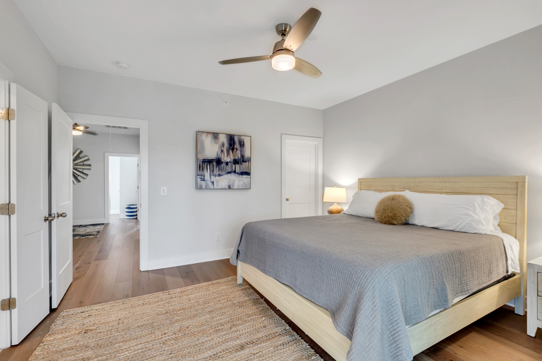 1144 Lock 4 Road, Unit F5 Gallatin, TN 37066 - Photo 29 of 40 a bedroom with a large bed and a chandelier