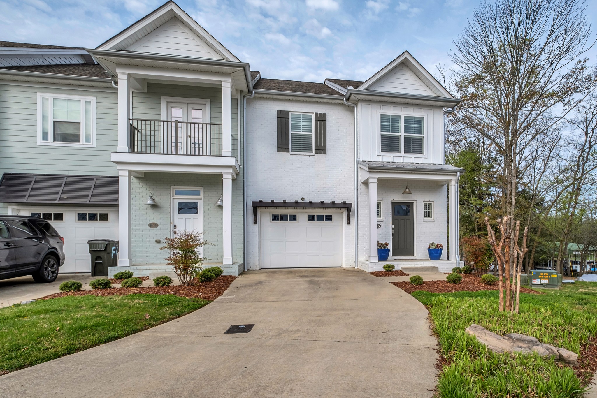 1144 Lock 4 Road, Unit F5 Gallatin, TN 37066 - Photo 3 of 40 a front view of a house with a yard and trees
