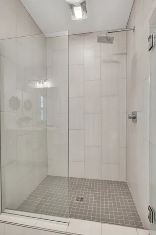 a bedroom with a bed a desk and chair