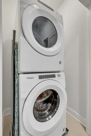 a view of a big house with a big yard and large trees