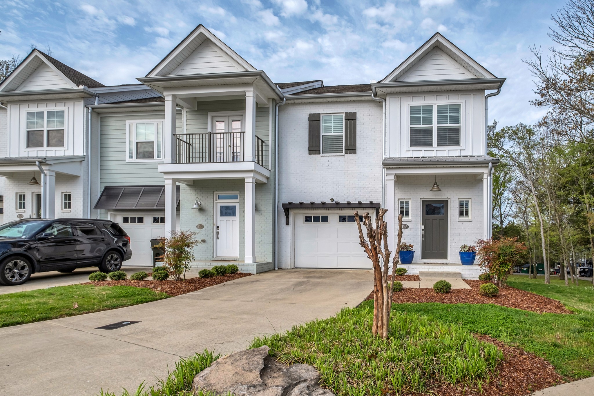 1144 Lock 4 Road, Unit F5 Gallatin, TN 37066 - Photo 4 of 40 a front view of a house with a garden and porch
