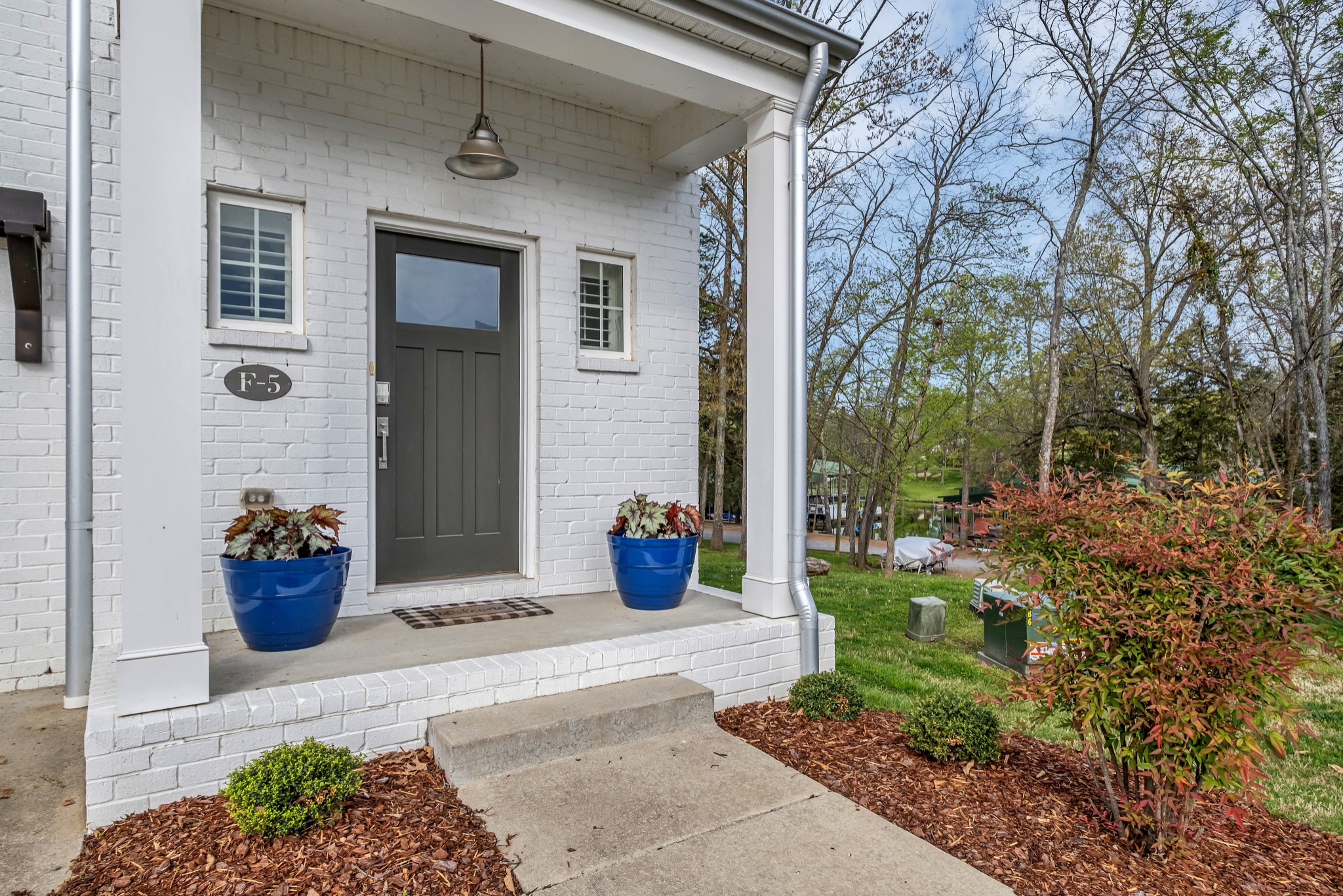 1144 Lock 4 Road, Unit F5 Gallatin, TN 37066 - Photo 5 of 40 a view of a potted plants in front of a house