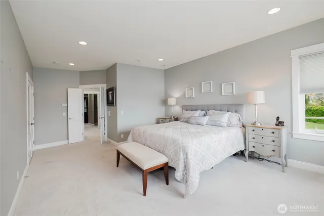 a bathroom with a tub sink shower and mirror