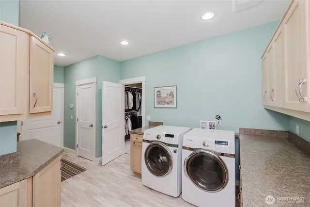 a hallway with a dining room and a white door