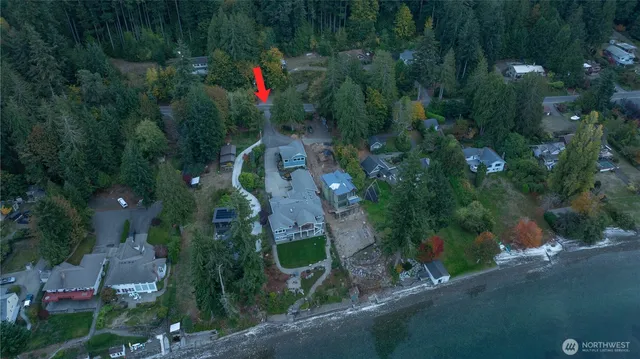 a view of a house with a yard and garage