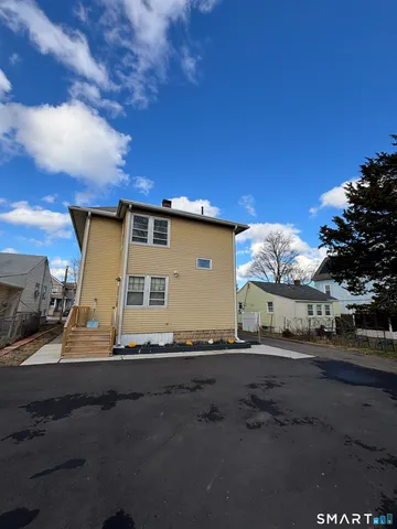 a front view of a house with lake view