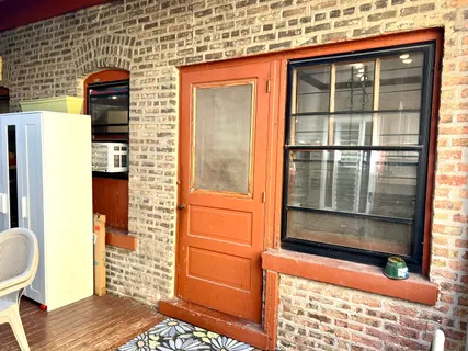 a front view of a house with a large window