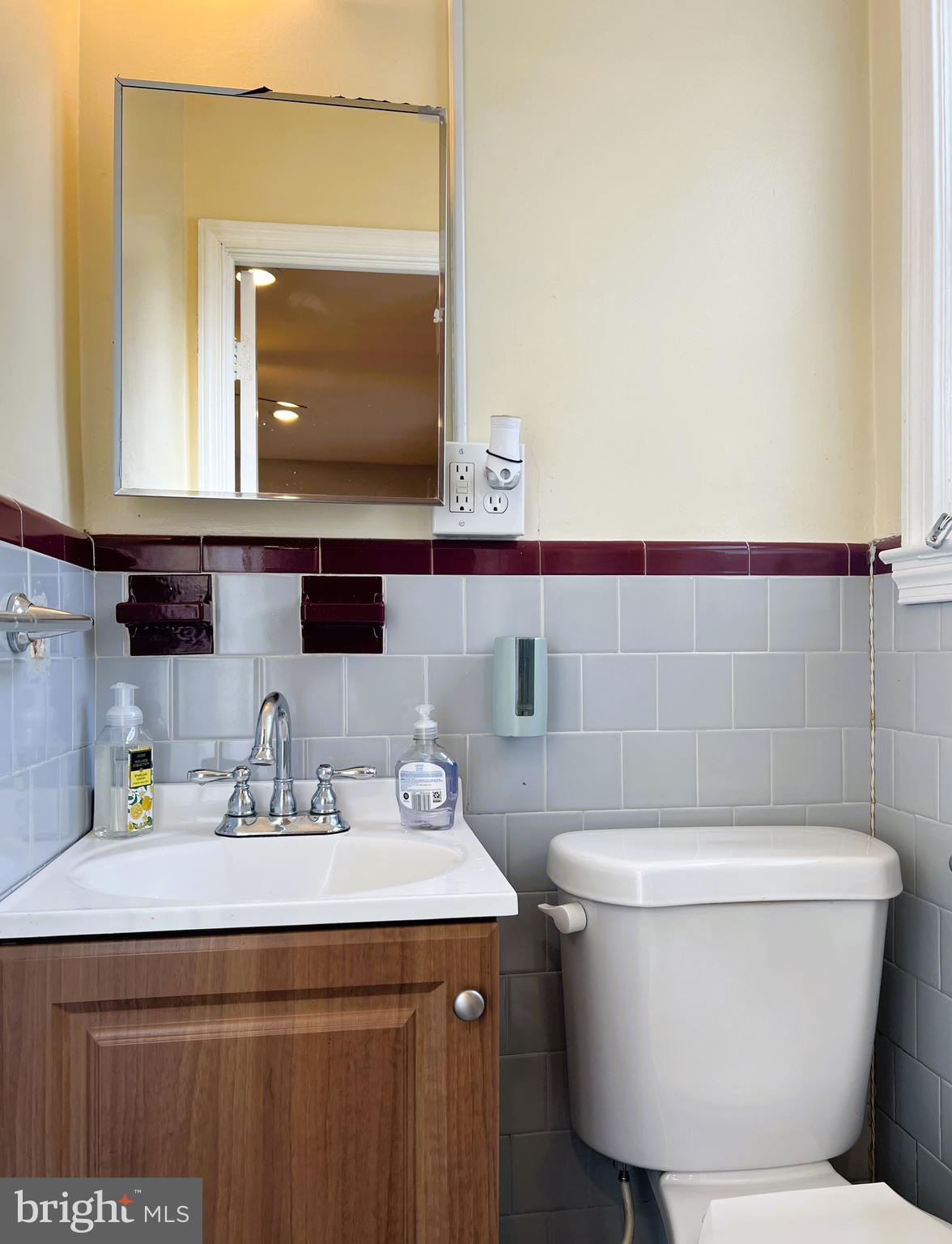 3705 Bancroft Road Baltimore, MD 21215 - Photo 32 of 50 a bathroom with a sink and a mirror