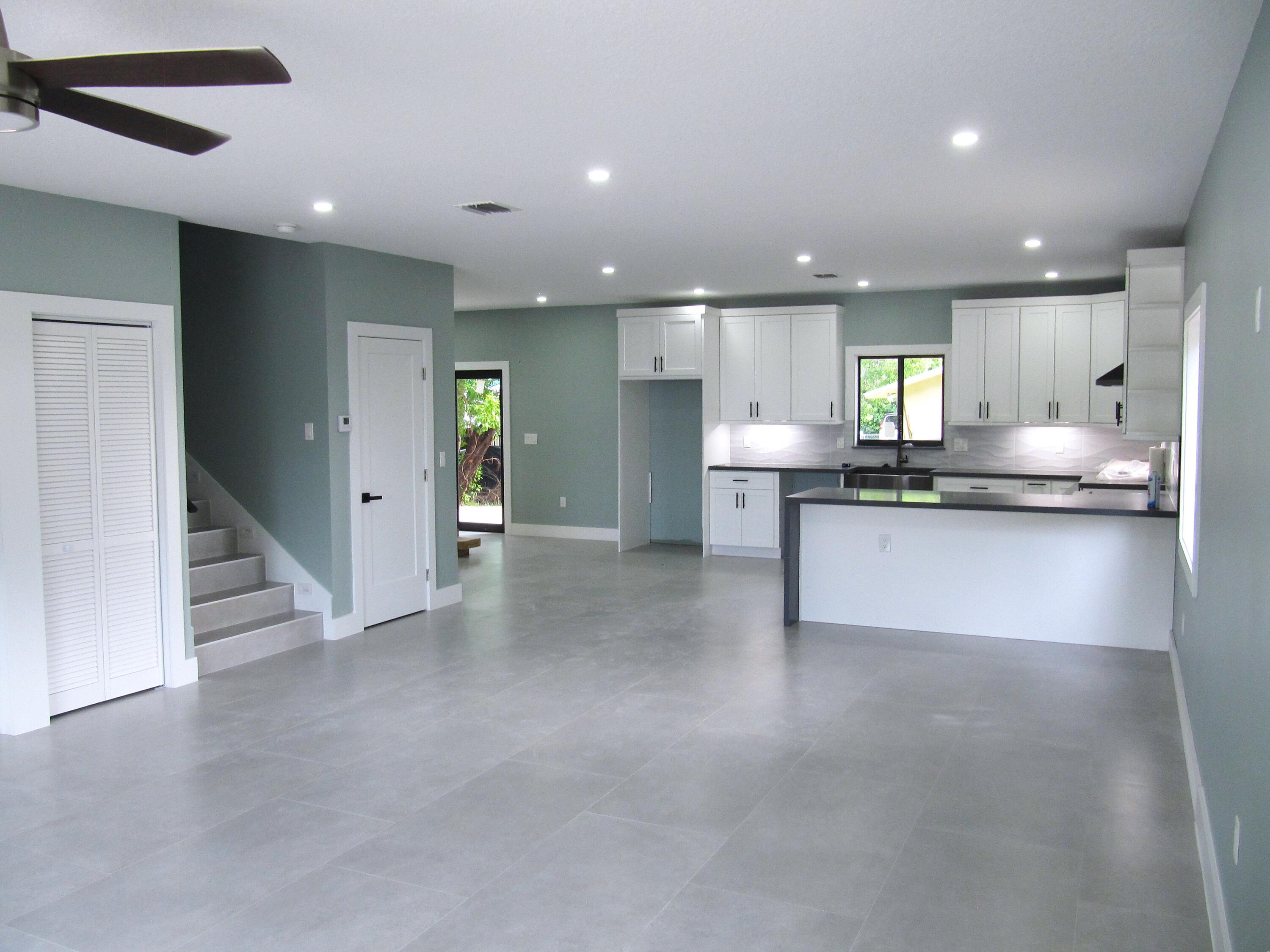 25 Abaco Road Key Largo, FL 33037 - Photo 3 of 17 a kitchen with stainless steel appliances granite countertop a refrigerator and a sink