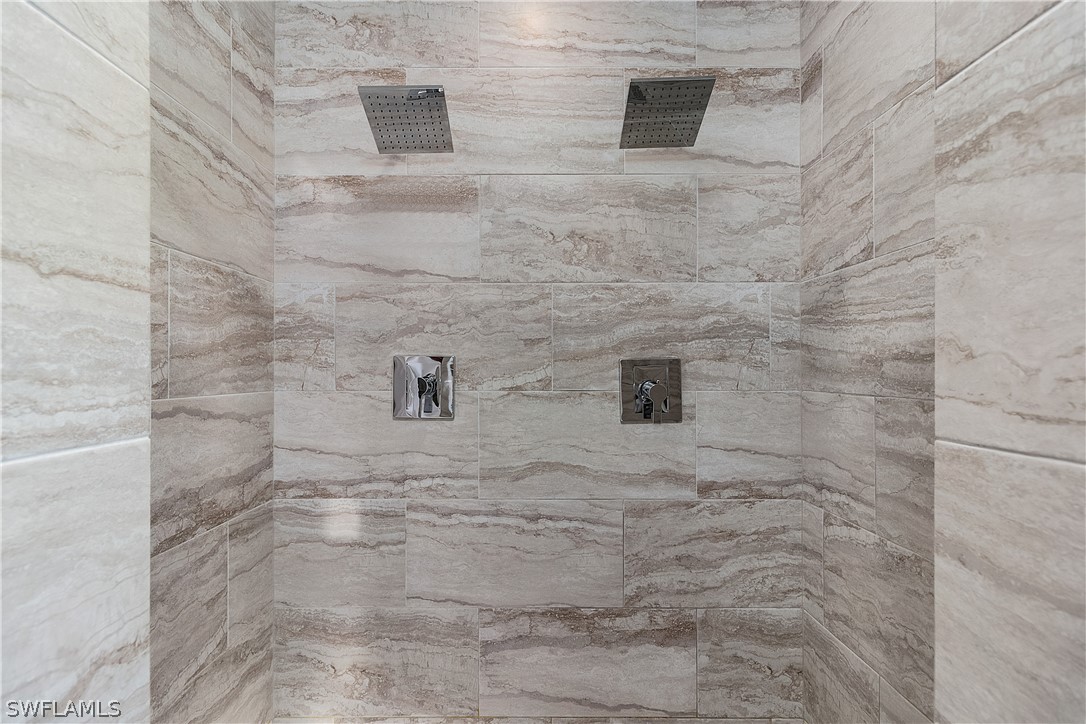 2204 Nelson Road North Cape Coral, FL 33993 - Photo 13 of 22 a bathroom with a shower