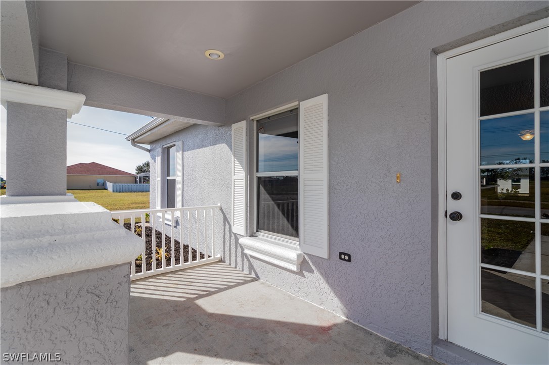 2204 Nelson Road North Cape Coral, FL 33993 - Photo 19 of 22 a view of a hallway with seating area