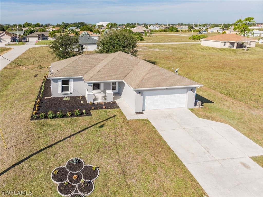 2204 Nelson Road North Cape Coral, FL 33993 - Photo 20 of 22 a view of a house with outdoor space