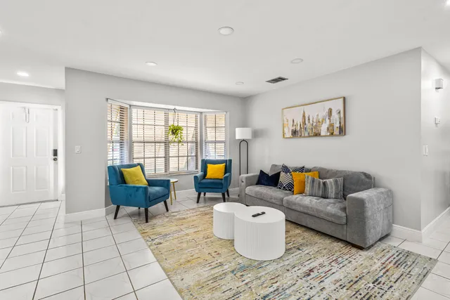 a living room with furniture and a table