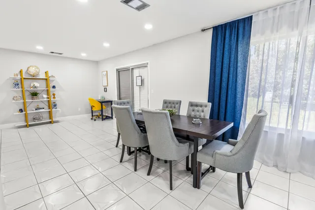a view of a dining room with furniture
