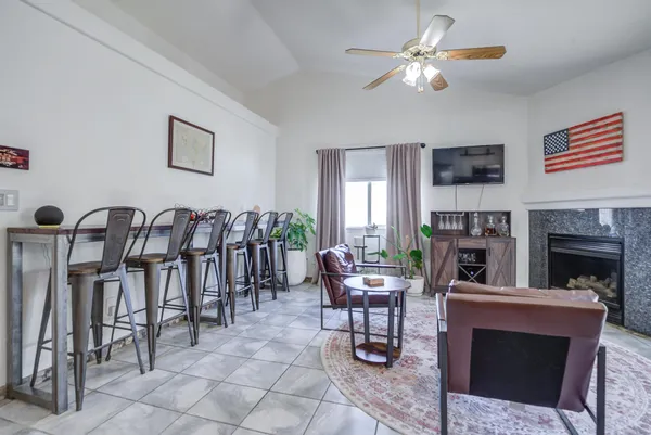 a kitchen with stainless steel appliances granite countertop a refrigerator a stove a sink and a refrigerator