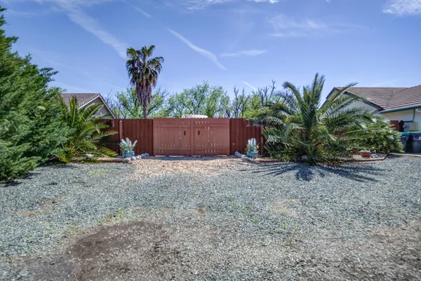 a big house with palm trees in front of it