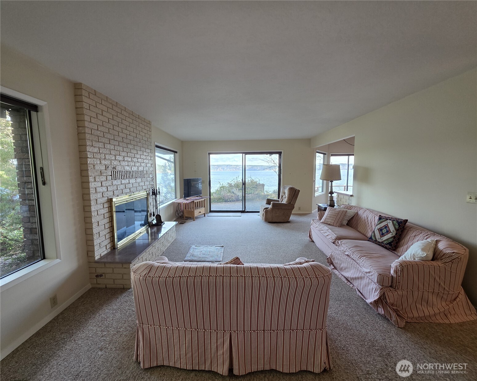 81 Wawa Point Place Brinnon, WA 98320 - Photo 16 of 37 a living room with furniture and a window