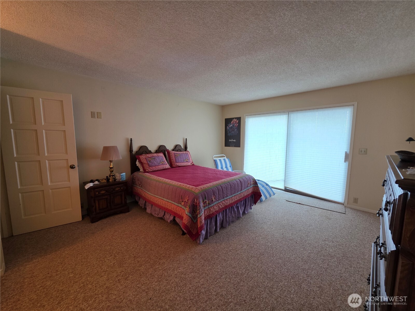 81 Wawa Point Place Brinnon, WA 98320 - Photo 20 of 37 a spacious bedroom with a bed and a window