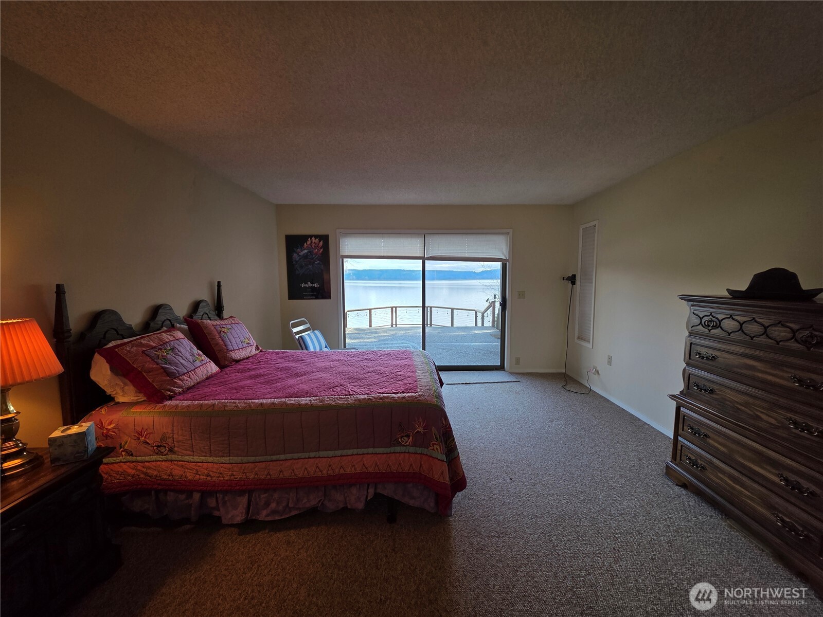 81 Wawa Point Place Brinnon, WA 98320 - Photo 21 of 37 a bed sitting in a bedroom next to a window