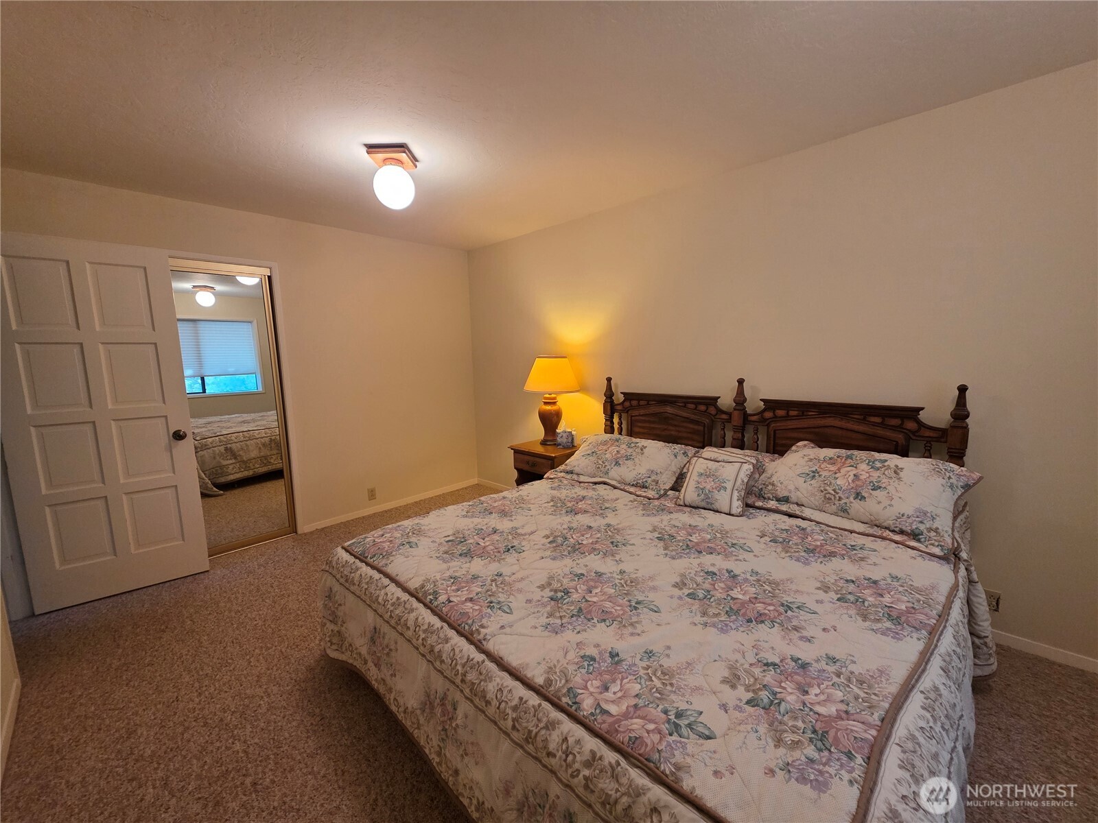 81 Wawa Point Place Brinnon, WA 98320 - Photo 25 of 37 a bedroom with a bed and a night stand