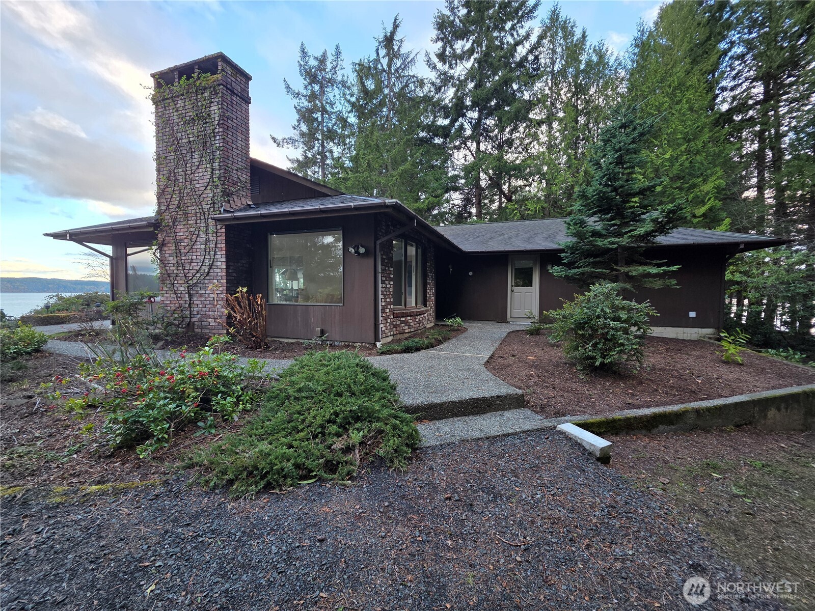 81 Wawa Point Place Brinnon, WA 98320 - Photo 34 of 37 a front view of a house with garden