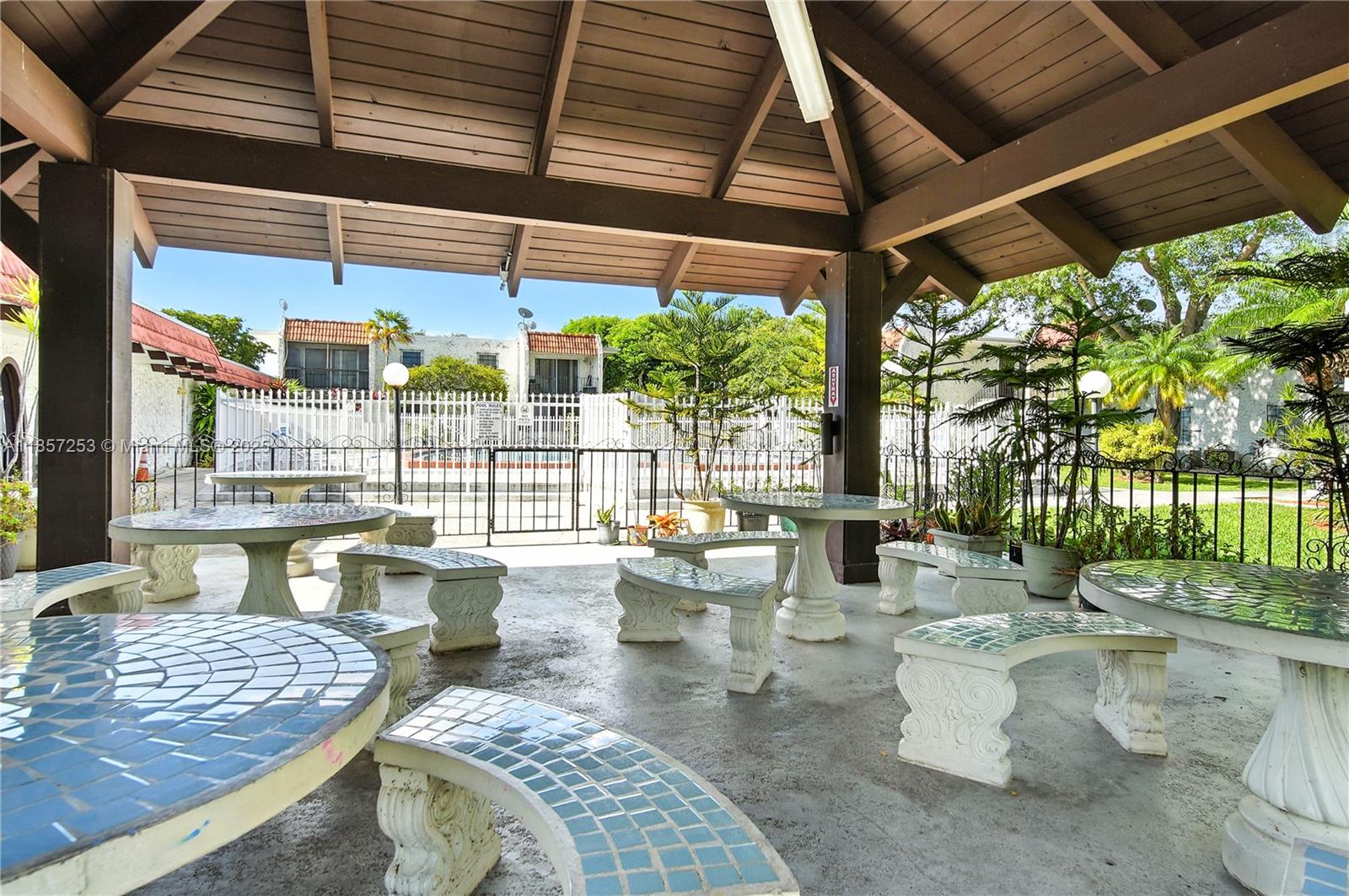 8701 Southwest 141st Street, Unit B1 Miami, FL 33176 - Photo 14 of 22 a view of outdoor space yard and patio