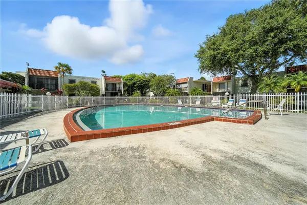 a view of a swimming pool with a lounge chair