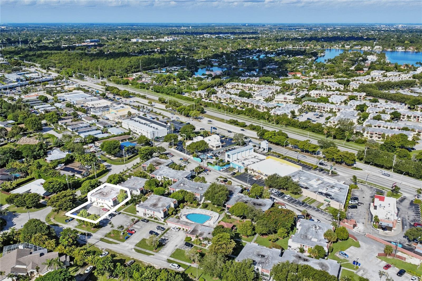 8701 Southwest 141st Street, Unit B1 Miami, FL 33176 - Photo 20 of 22 an aerial view of residential houses with outdoor space and trees