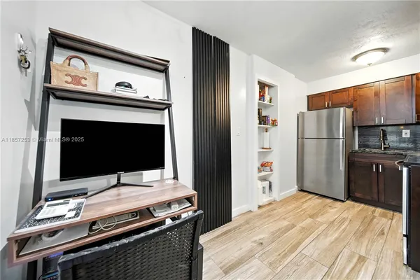 a kitchen with a refrigerator stove and microwave