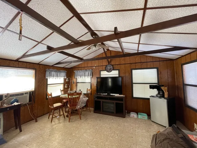 a room with furniture and flat screen tv