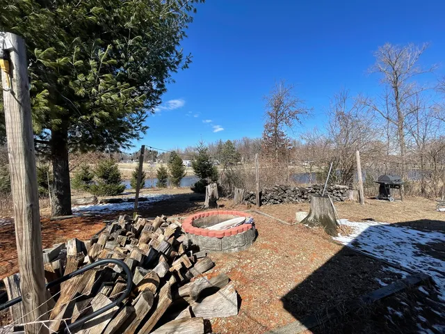 a view of a bench in a backyard