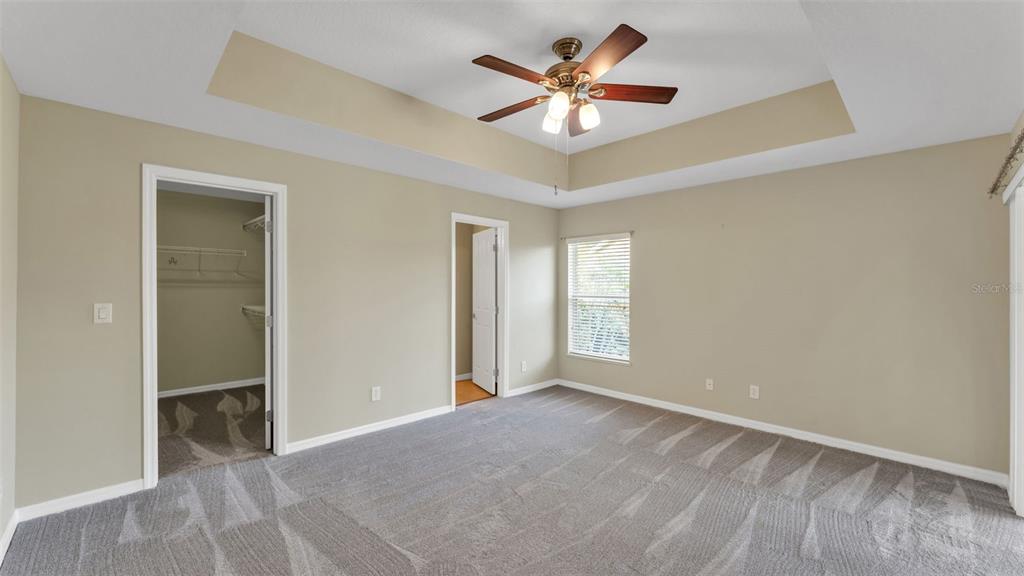 3588 Raleigh Drive Winter Haven, FL 33884 - Photo 18 of 40 an empty room with a ceiling fan and a window