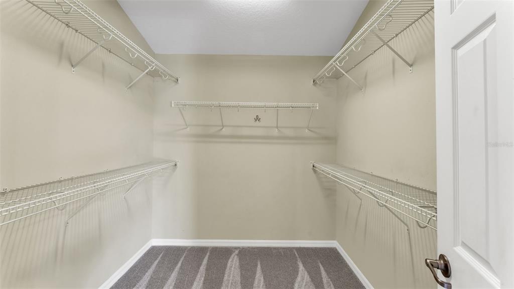3588 Raleigh Drive Winter Haven, FL 33884 - Photo 21 of 40 a view of walk in closet with empty racks