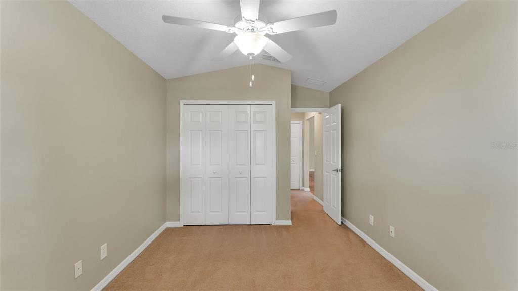 3588 Raleigh Drive Winter Haven, FL 33884 - Photo 25 of 40 an empty room with a ceiling fan and a window