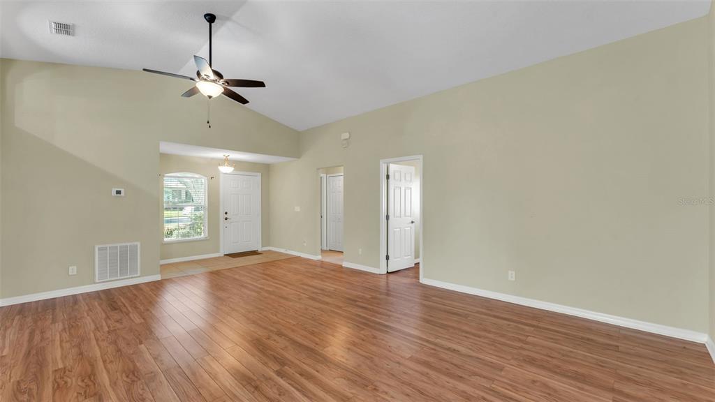 3588 Raleigh Drive Winter Haven, FL 33884 - Photo 3 of 40 a view of an empty room and wooden floor