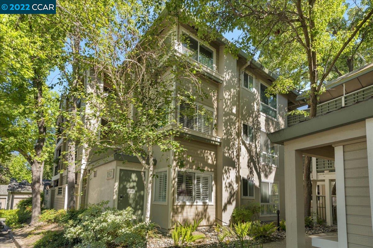 2550 Oak Road, Unit 119 Walnut Creek, CA 94597 - Photo 1 of 1 front view of a brick house with a large trees