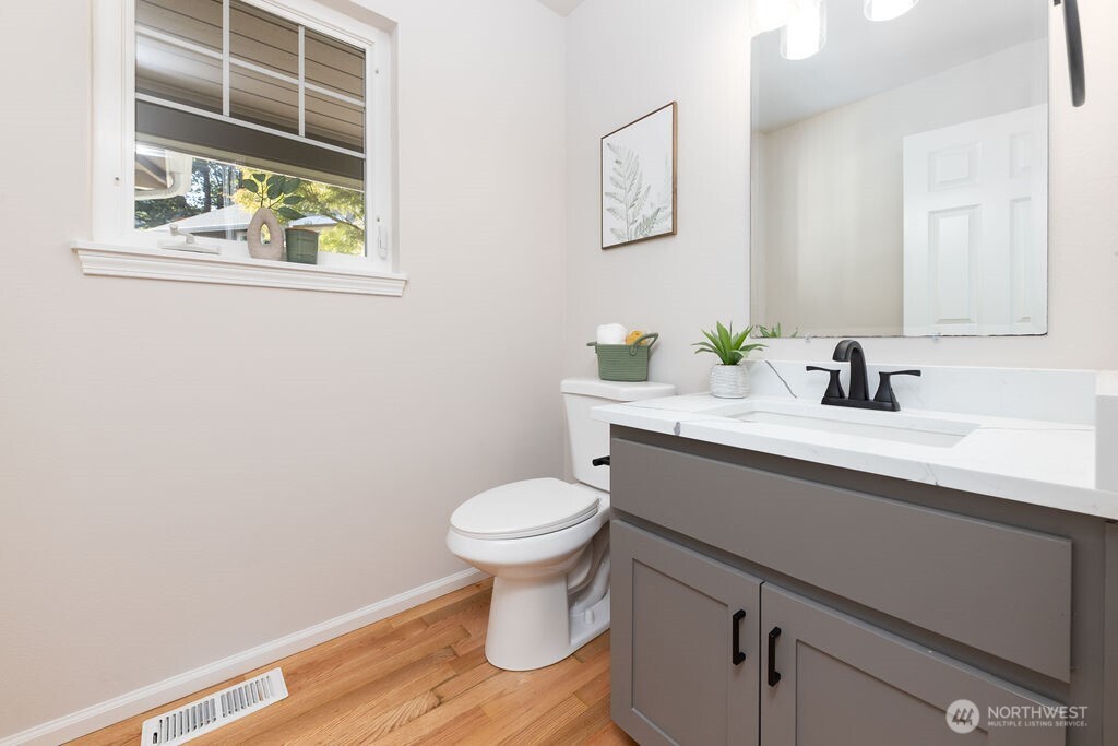 1065 Southwest 12th Street North Bend, WA 98045 - Photo 12 of 27 a bathroom with a sink and a toilet