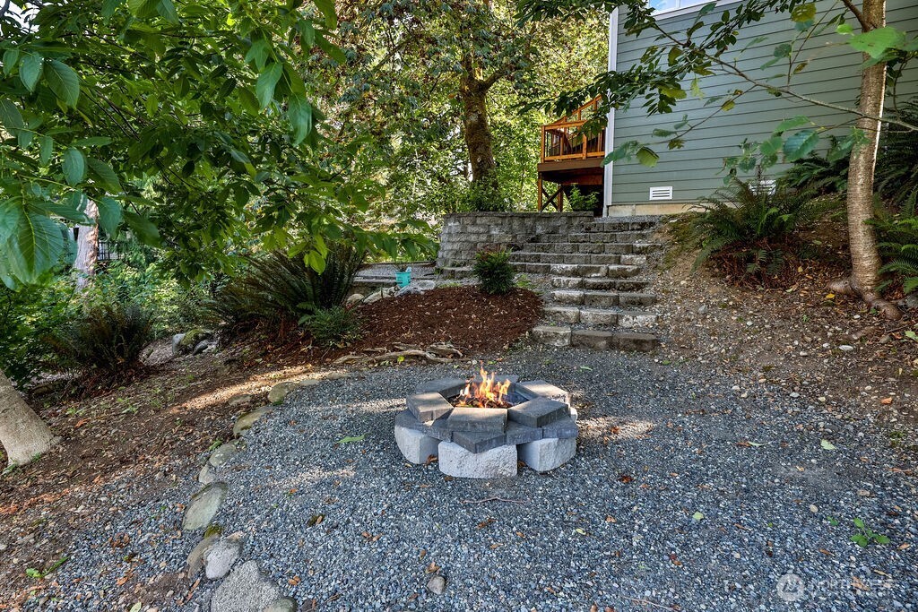 1065 Southwest 12th Street North Bend, WA 98045 - Photo 26 of 27 a view of a backyard with plants and a fountain