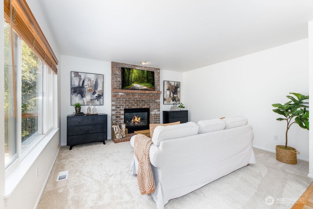 1065 Southwest 12th Street North Bend, WA 98045 - Photo 10 of 27 a living room with furniture and a fireplace