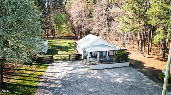 a view of a house with a yard porch and sitting area