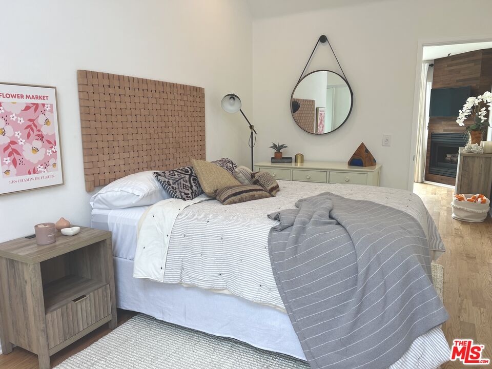 25366 Malibu Road, Unit 2 Malibu, CA 90265 - Photo 13 of 25 a bedroom with a bed and a chandelier