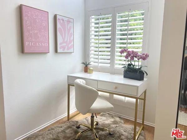 a dining room with furniture and window