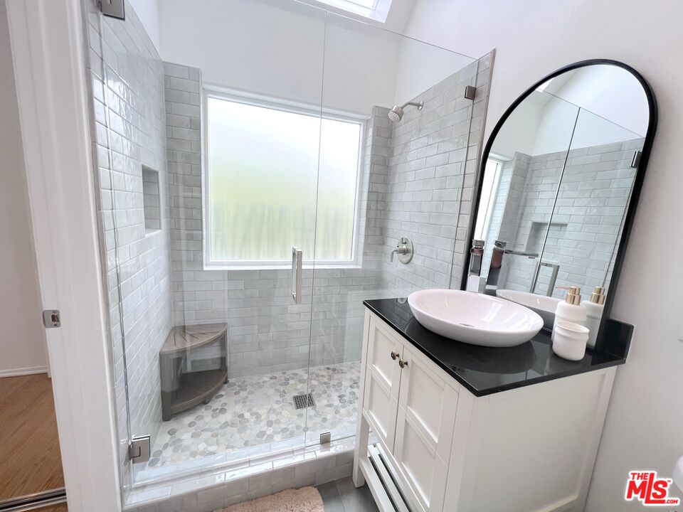 25366 Malibu Road, Unit 2 Malibu, CA 90265 - Photo 17 of 25 a bathroom with a sink and a mirror