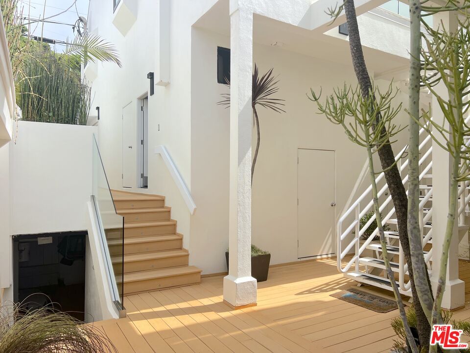 25366 Malibu Road, Unit 2 Malibu, CA 90265 - Photo 20 of 25 a view of a house with a door and wooden floor