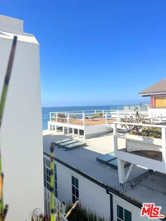 a view of a balcony with an ocean view